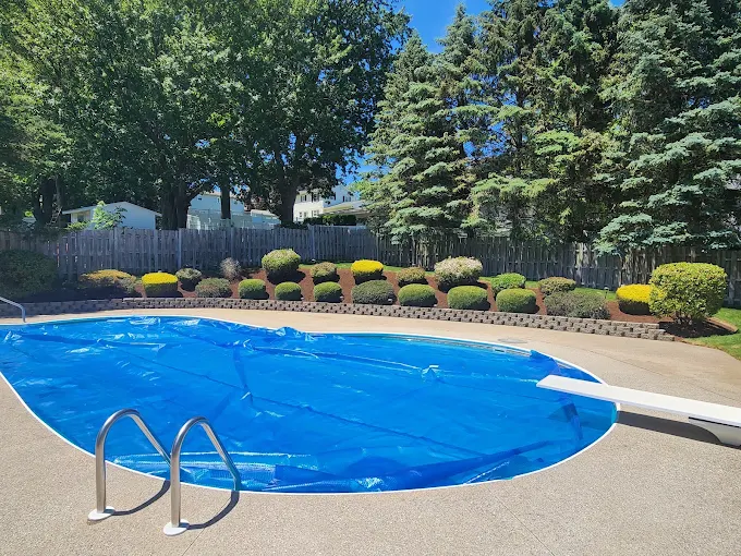 Poolside landscaping with retaining wall